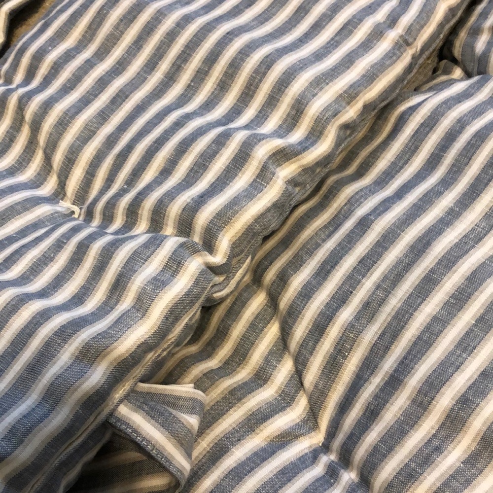 Pottery Barn Kids crib bumper is chambray/grey/white